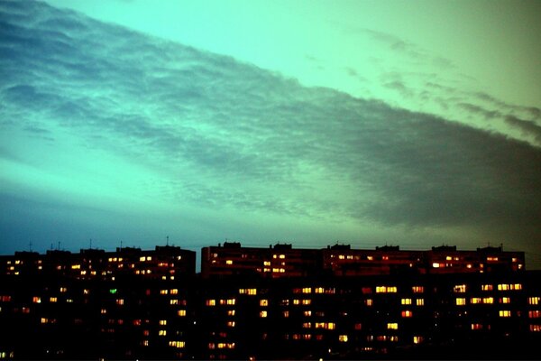 Sunset northern lights city houses windows