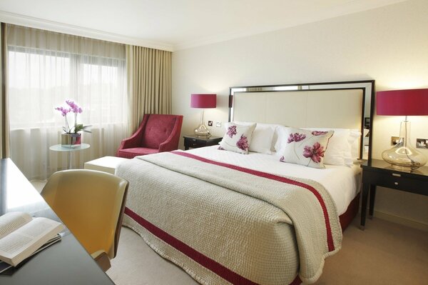 Bedroom interior in white and red tones