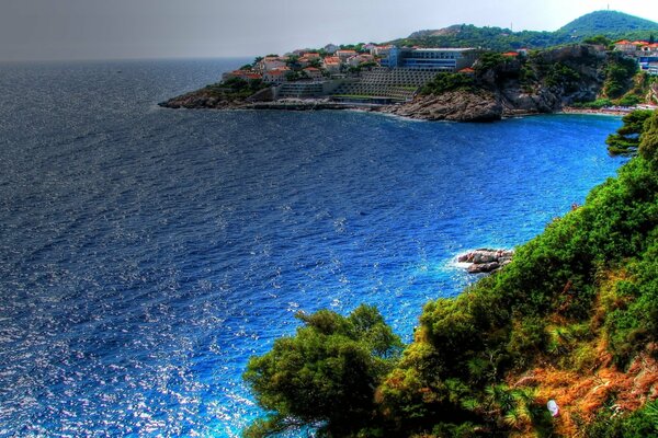 Sunny day on the shore of the blue sea eruption