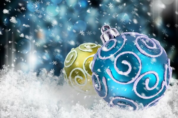 Christmas background of Christmas balls in the snow