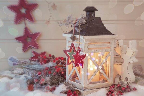 Christmas lantern with candles with deer and stars