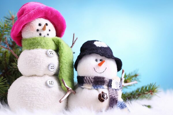 Cute snowmen in scarves and hats