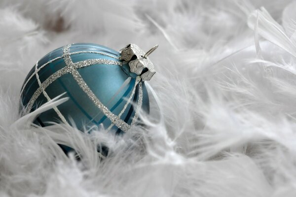 Macro photography of a festive ball in feathers