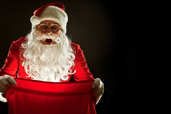 New Year, festive light, Santa Claus with a gift bag