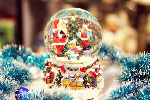 A snow globe with a Christmas theme inside