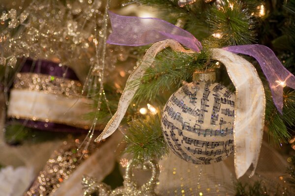 Christmas ball with notes on the Christmas tree