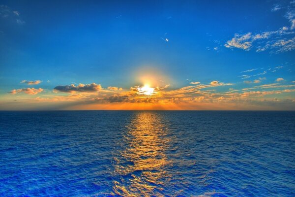 Sunset over the sea horizon