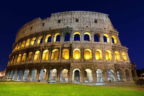 Amphitheater of the Colosseum with a backdrop on a dark background