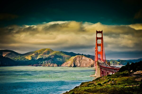 Image of mountains, bridge, said sky