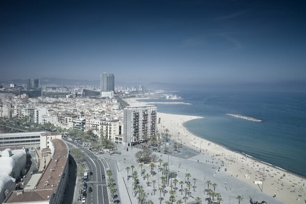 A white sandy beach and a blue sea turning into the sky