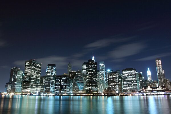 The night lights of America reflected in the ocean waters