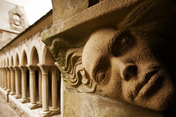 Greek structure with a face and columns