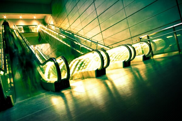 The green escalator glows mysteriously