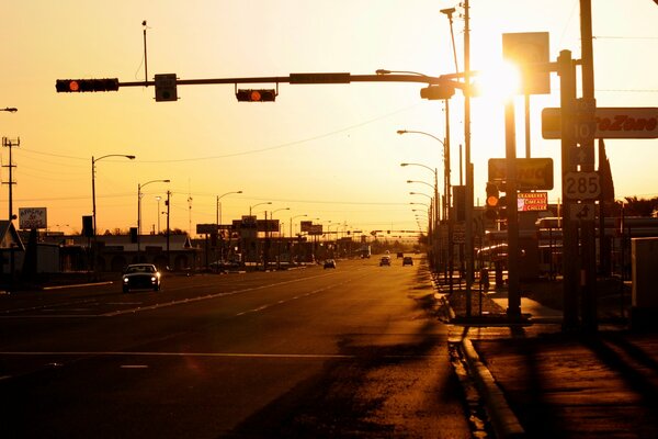 Evening road in the rays of the setting sun