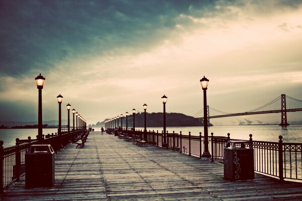 Wet embankment. Burning lanterns. Lonely embankment