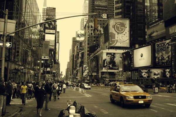 New York. City street with walking people, taxis, shops, advertising