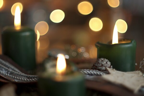 Green candles on a festive background