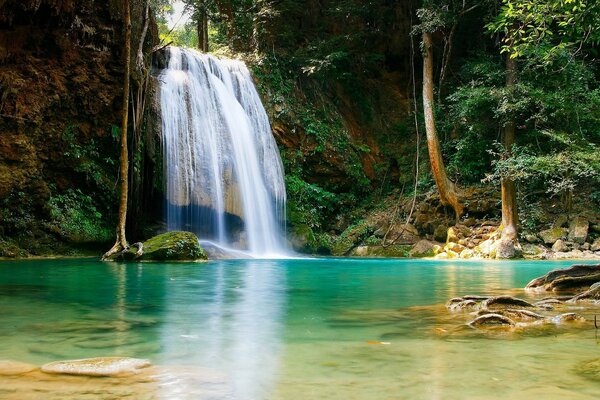 Waterfall and crystal clear lake