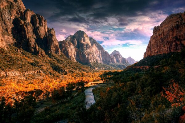 Landscape with yellow forest, river and mountains