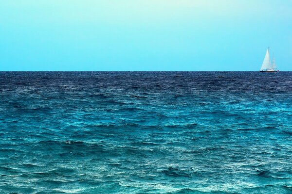 Blue waves with a ship in the background