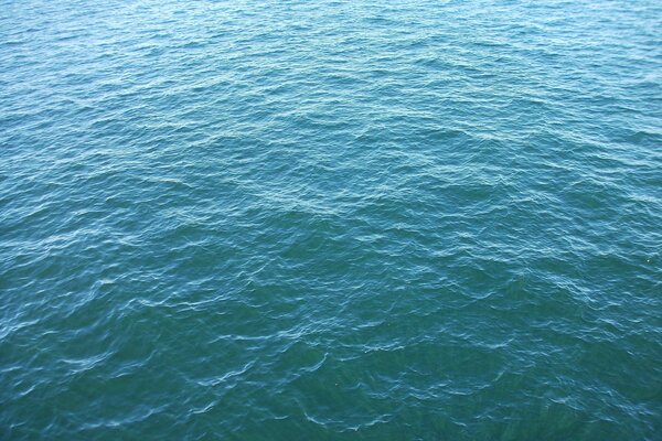 Light ripples of blue sea water