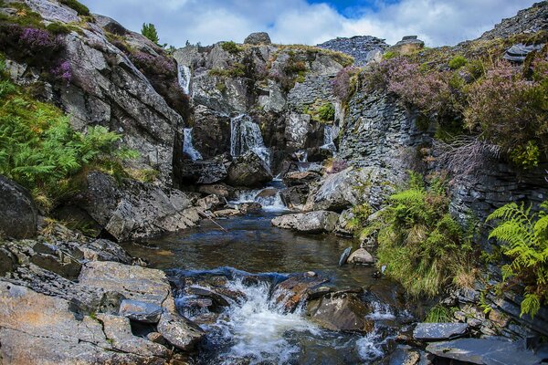 Waterfall and river in the rocks in the UK