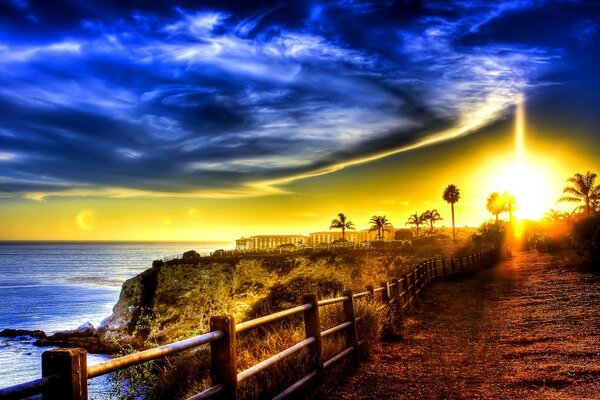 The road along the ocean coast at sunset