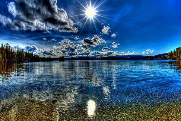 Bright sun over clear water