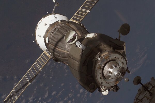 The Soyuz spacecraft and the Russian cargo ship from Earth docked