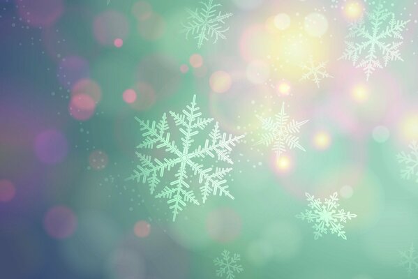 Beautiful snowfields on a multicolored background with a bokeh effect