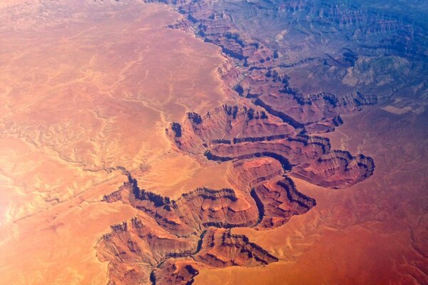 Red-brown huge canyon in the distance