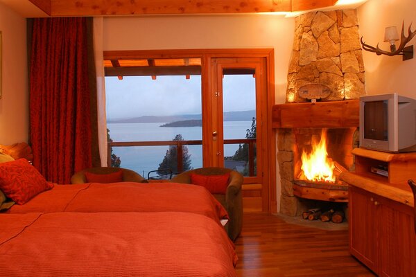 A warm room with a balcony overlooking the lake