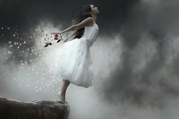 El vuelo del alma. Una chica con un vestido blanco en una roca. Nubes. Tormenta de emociones. Caída desde un acantilado
