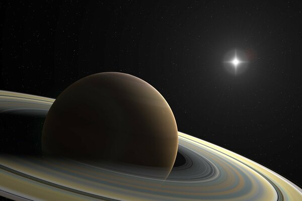 Saturn s rings on the background of a bright star in the boundless cosmos