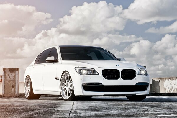 White tuned BMW 750 on the roof