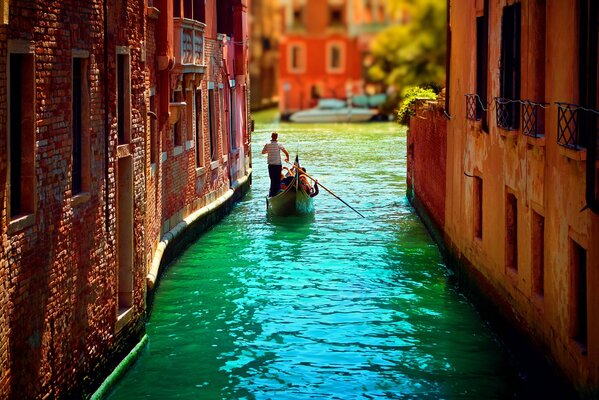 Venice city street with a boat on the water