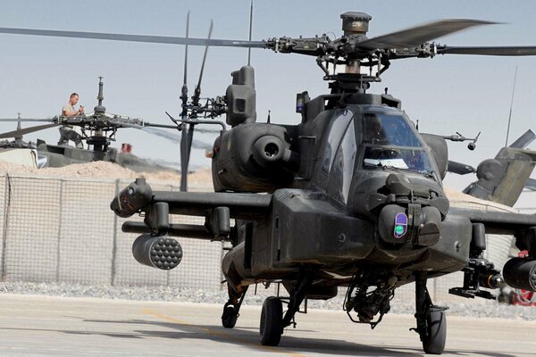 AH - 64 combat helicopter at the military parking lot
