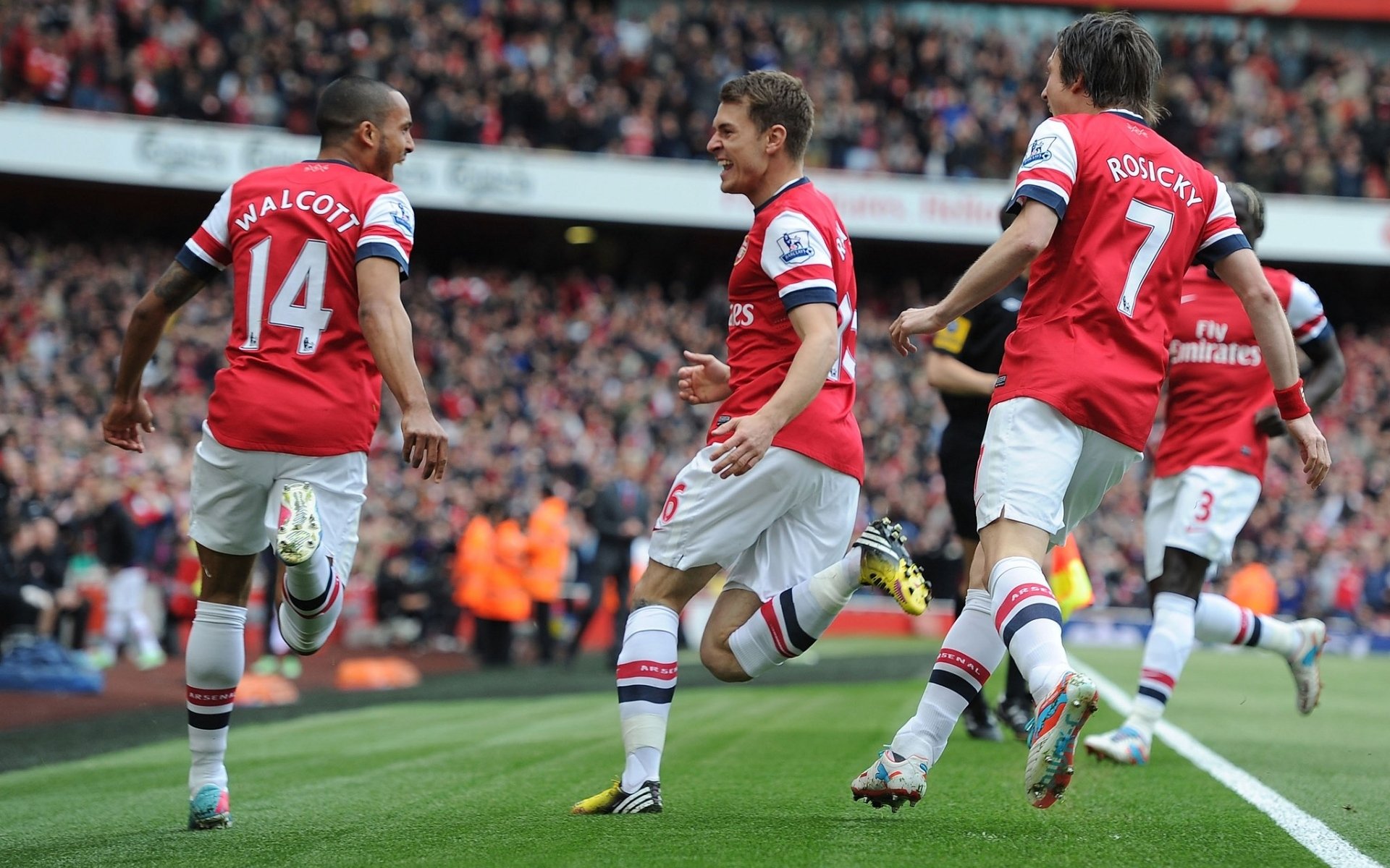 arsenal football club gunners players theo walcott ramsey tomas rosicky bakari sanya stands background