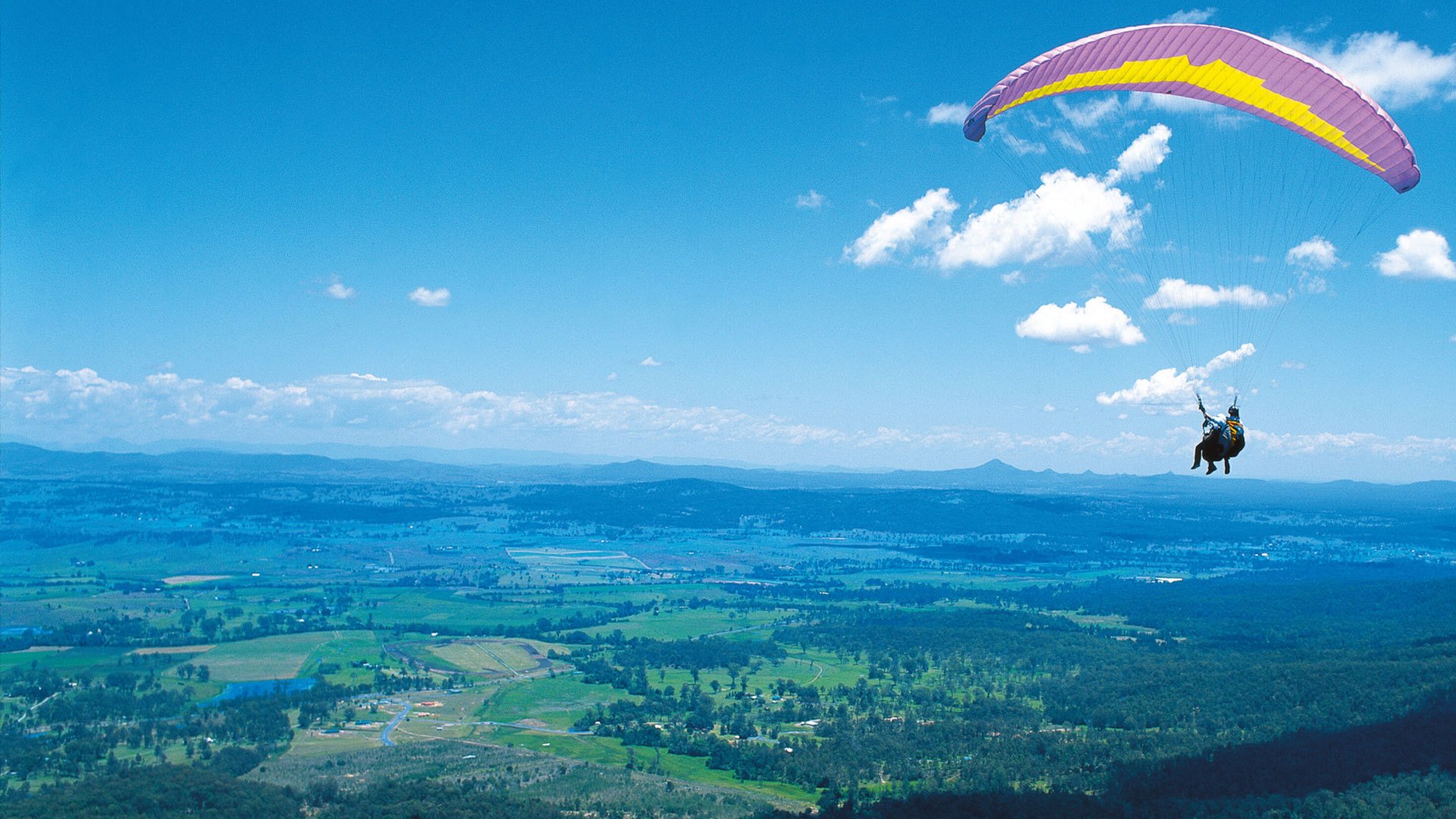 paragliding paragliding man flight mountains sky clouds earth altitude