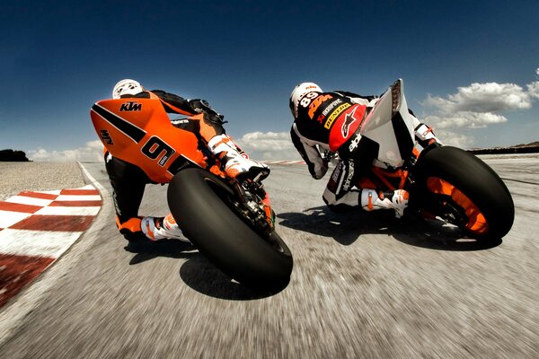 Motorcyclists are racing at high speed