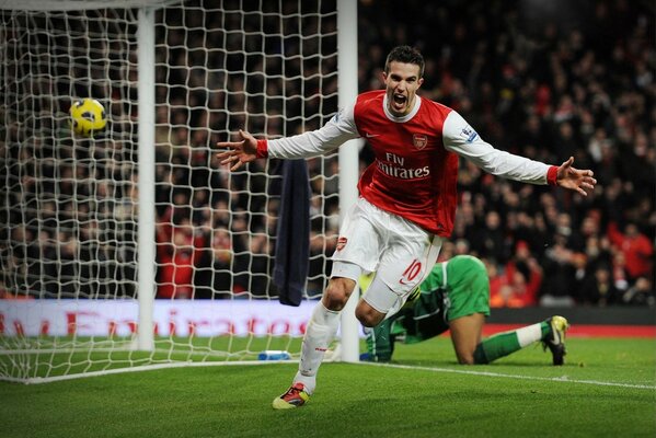 Footballer van Persie scores a goal