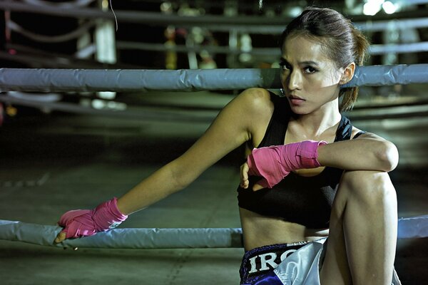 Cute girl in the boxing ring