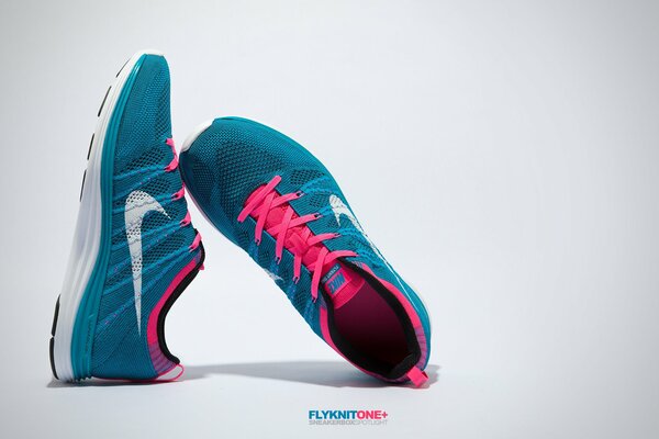 Turquoise sneakers with pink Nike laces