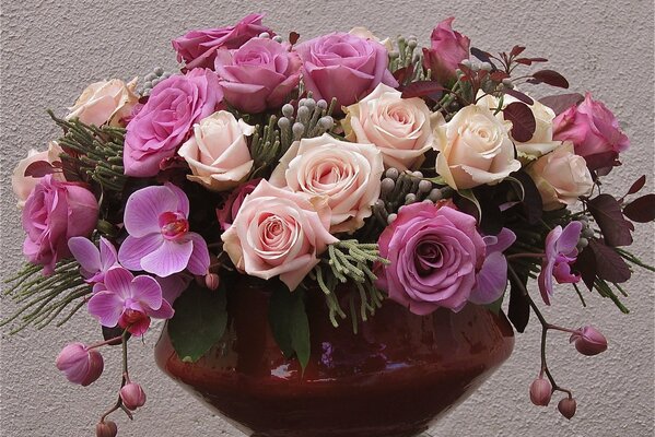 A fading bouquet of purple and white roses