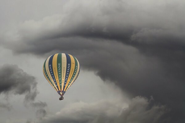 The balloon is flying in dark clouds