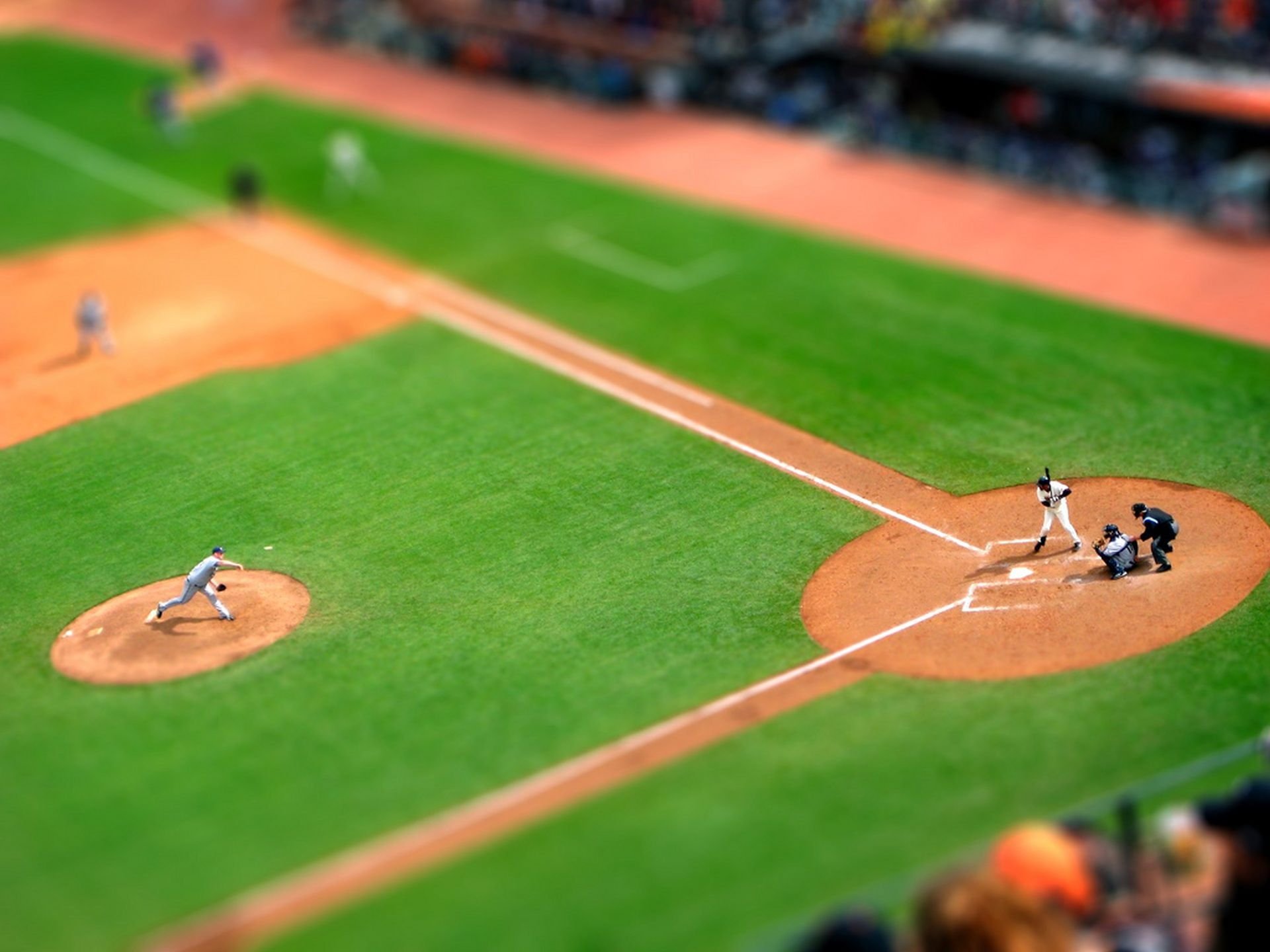 tilt shift baseball players feed turf game