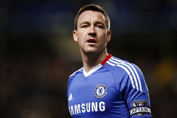Chelsea football player in blue uniform