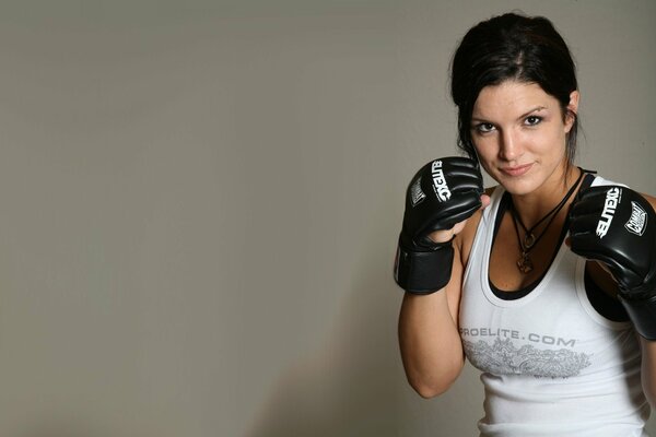 UFC champion Gina Carano poses in boxing gloves