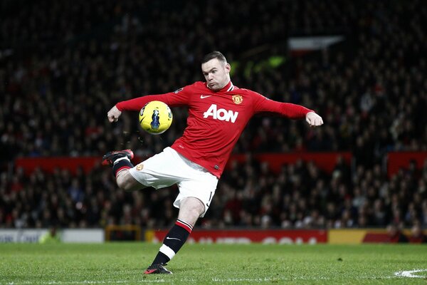 Manchester United footballer hits the ball