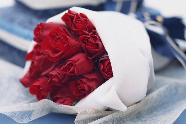 A delicate bouquet of red roses grew in the fabric